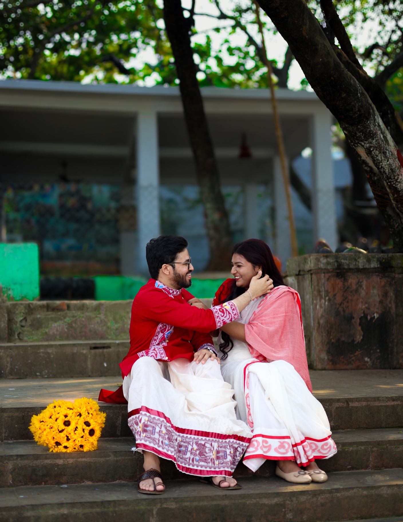 Couple sharing a laugh on temple steps
