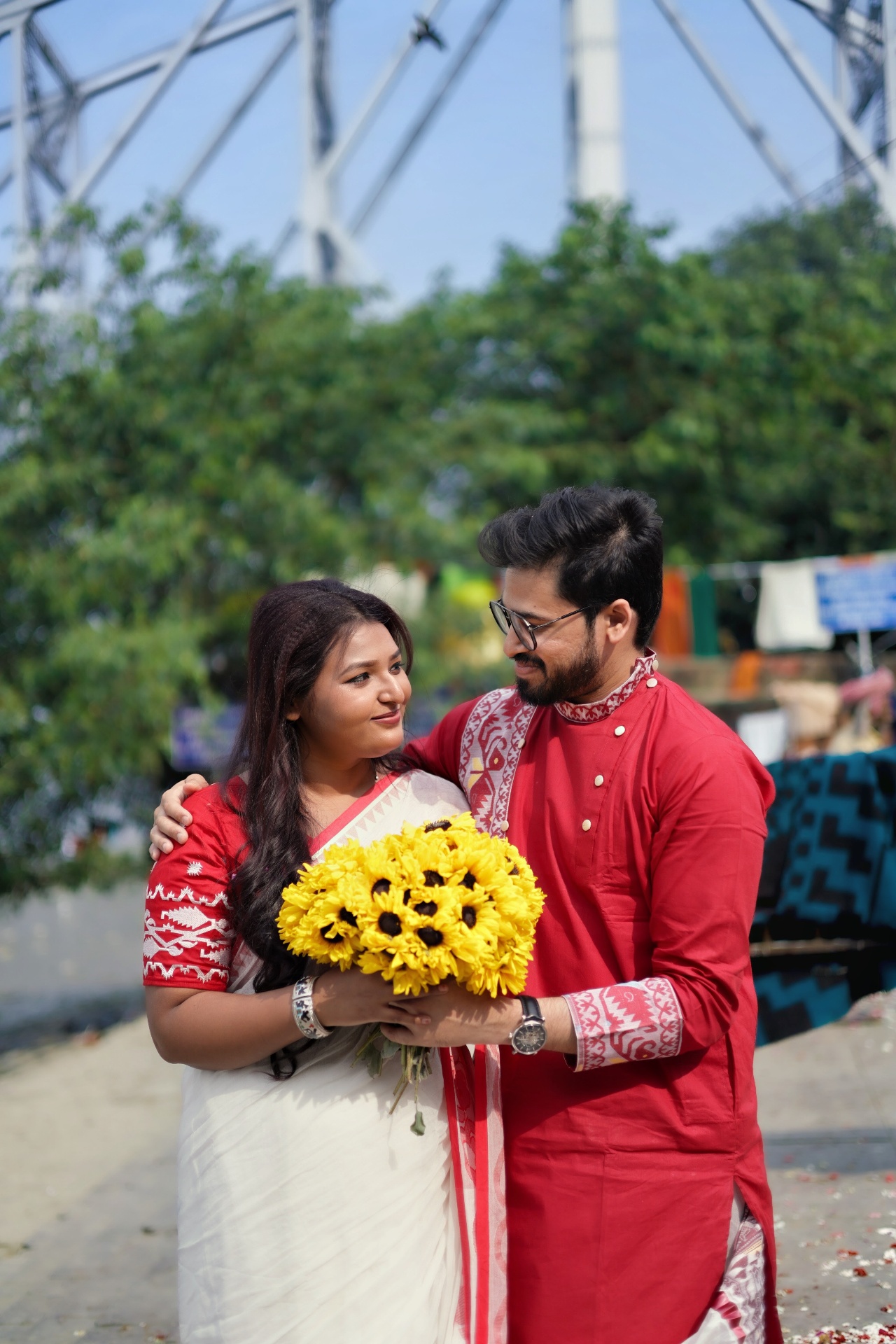 Couple in red and white with sunflowers